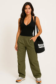 WOMEN'S CASUAL OUTFIT WITH BLACK HALTER TOP AND GREEN CARGO PANTS