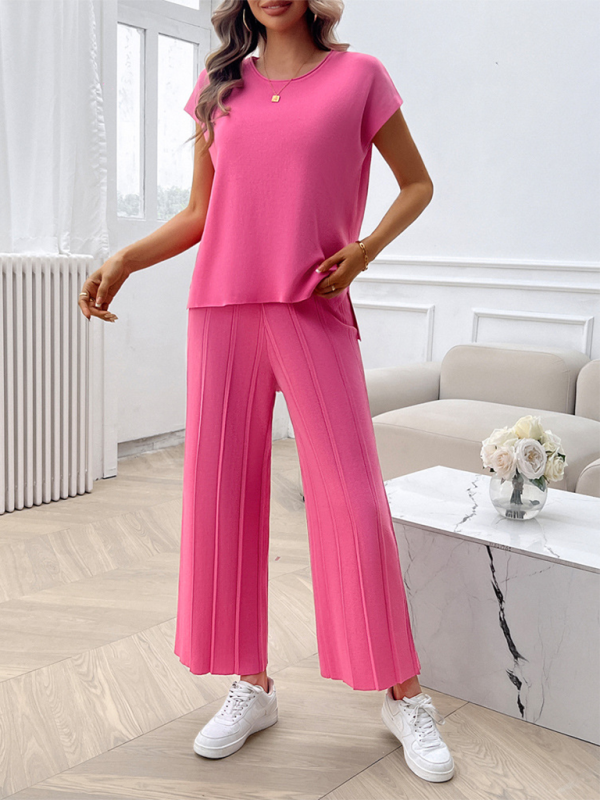 Woman wearing pink knit pantsuit from Women’s casual solid color sweater set collection