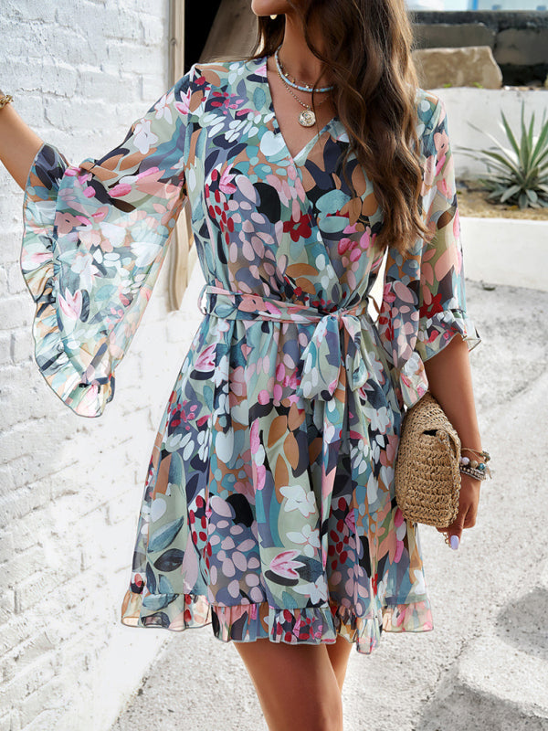 Elegant printed strappy dress with floral print, perfect for sophisticated occasions