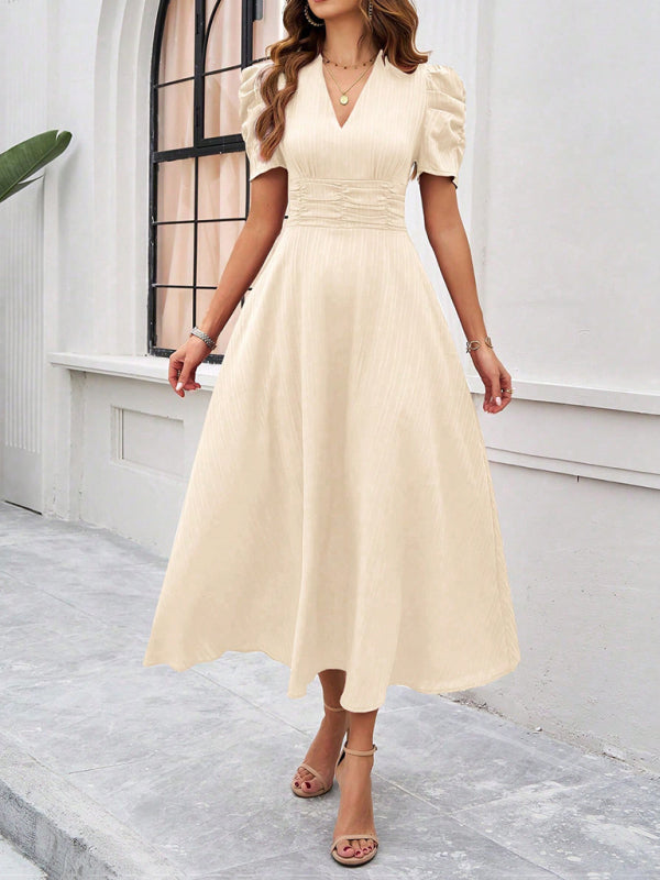 Cream-colored solid color midi dress displayed in women’s elegant waist dress product image