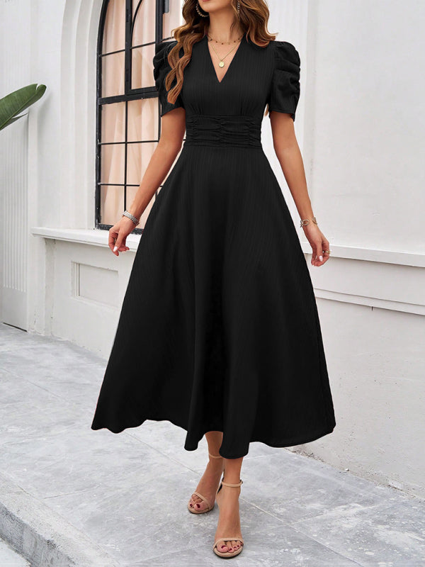 Women’s elegant solid color black midi dress with puff sleeves for sophisticated style