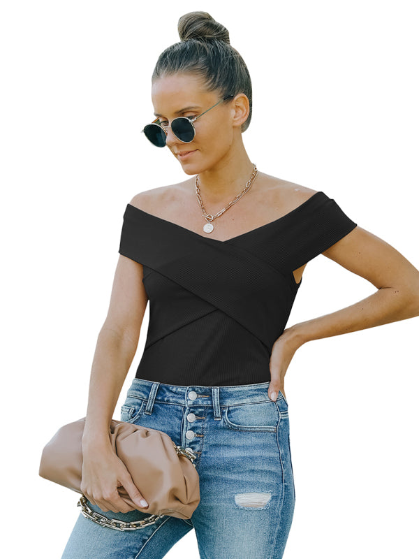 Woman in black crossover top with slight elasticity and jeans, showcasing women’s fashion skinny style