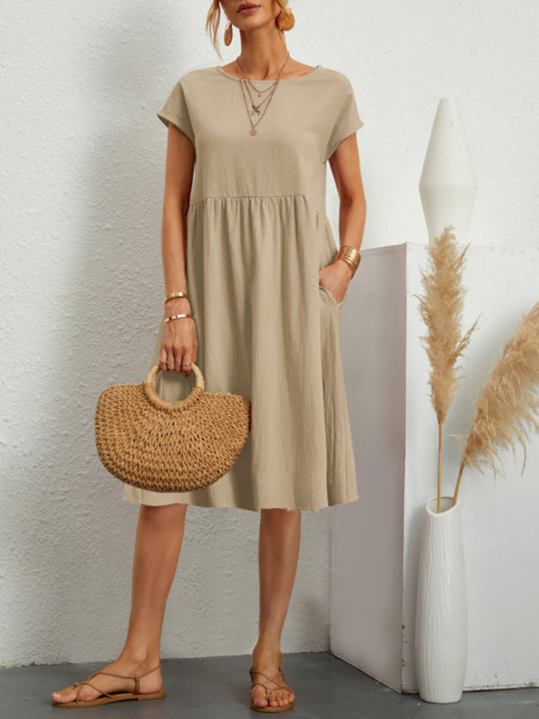 Beige midi dress with round neck and solid color design featuring cotton sleeves