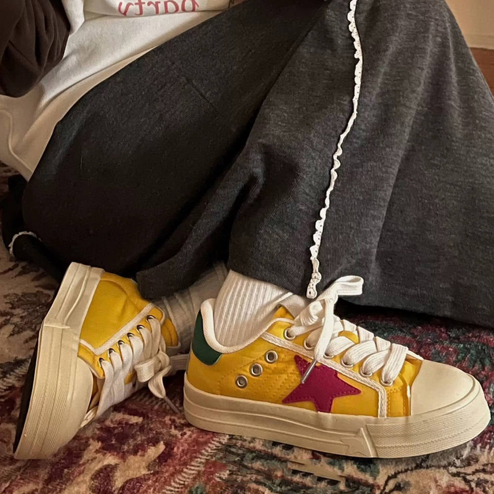 YELLOW STAR SNEAKERS WITH RED STAR PATCH