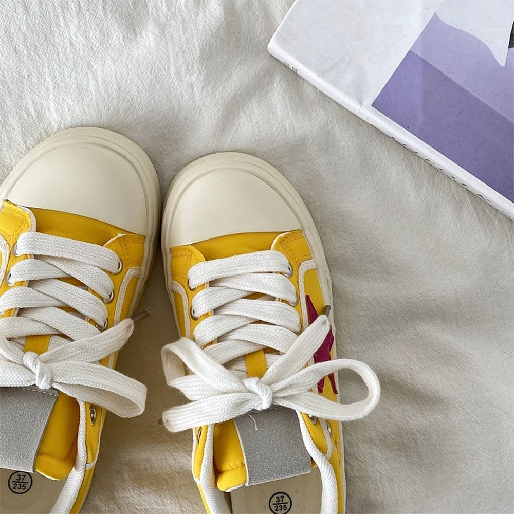 YELLOW STAR SNEAKERS WITH RED STAR PATCH